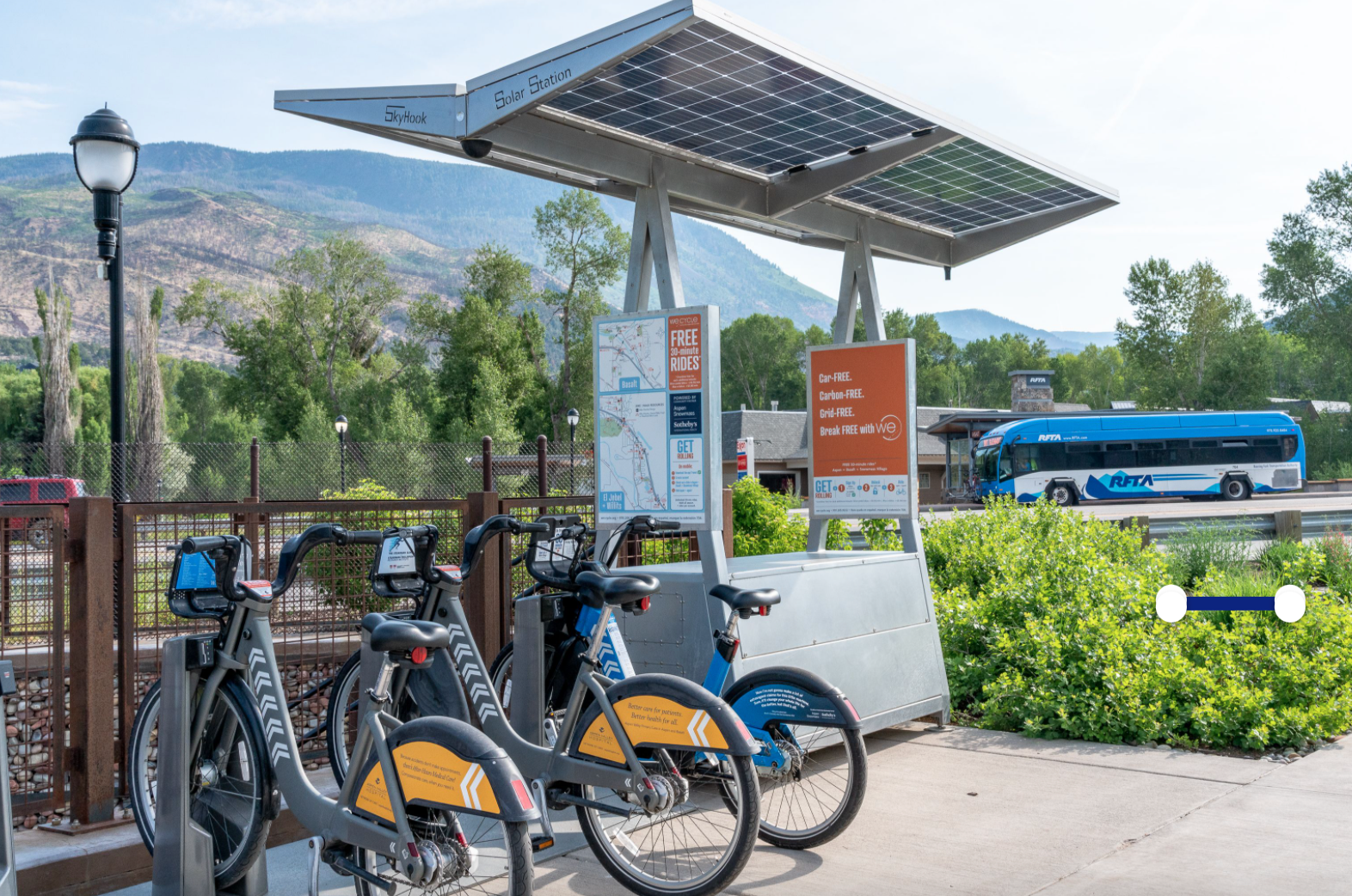 WE-cycle station with RFTA bus in the background