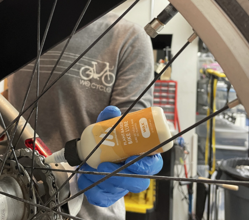 Jack applying mountainFLOPW eco-wax to a WE-cycle